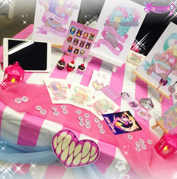 Dashis Koneko-Chan display featuring prints and merchandise