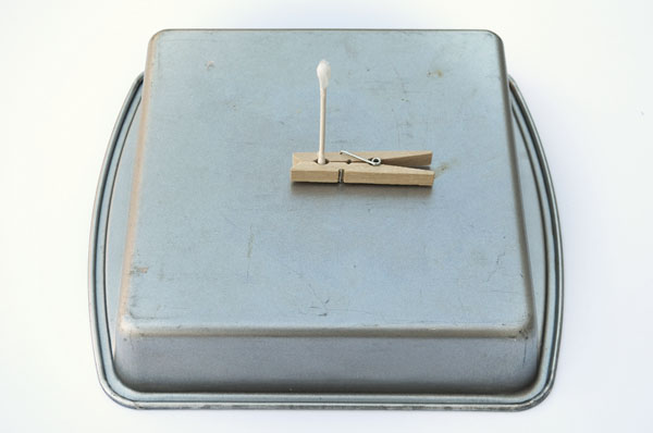 Place on a fireproof surface like an inverted cake pan