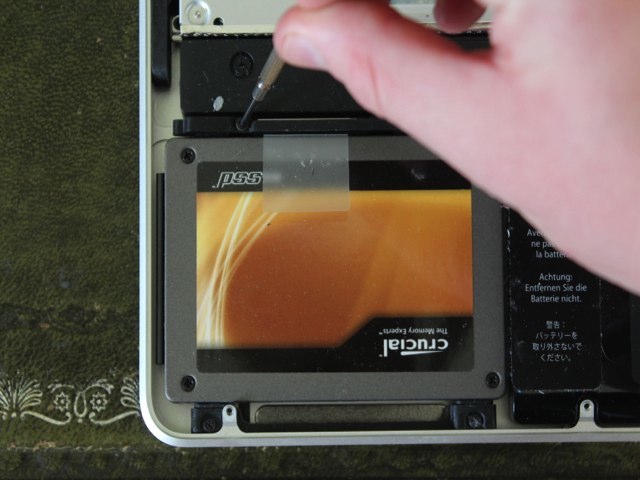 Unscrewing the SSD retainer